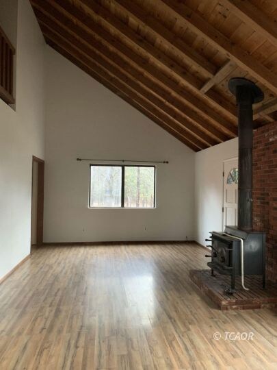 Living Room w/ Vaulted Ceiling