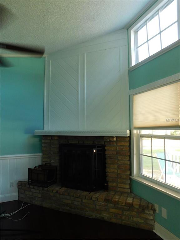 Living Room features vaulted ceilings, lots of dec