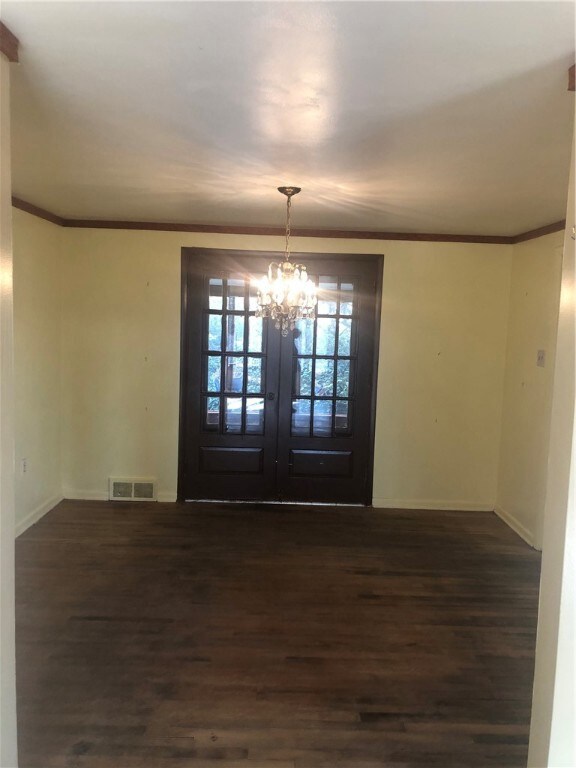 Dinning Room with double doors leading to enclosed
