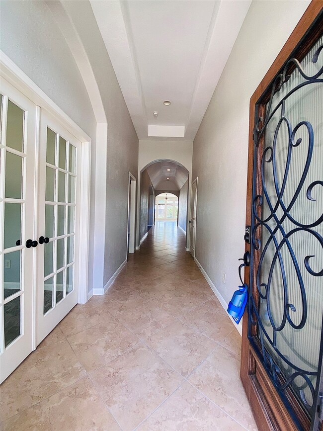 Inside you have Tray and Coffered Ceilings, Nicely appointed French Doors to your Flex space (L) and a welcoming entrance to your new home.