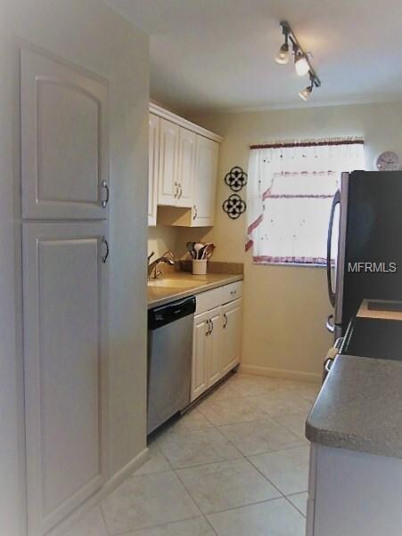 Kitchen with plenty of cabinetry and panty.