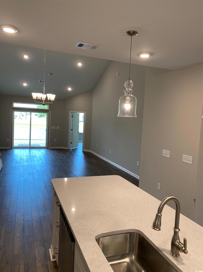 Kitchen featuring plenty of natural light, lofted 