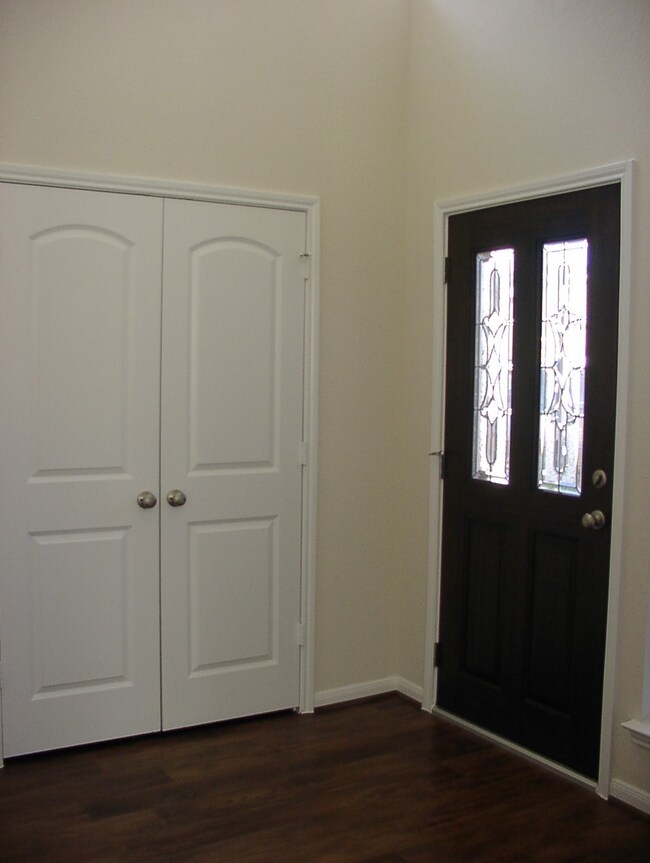 Foyer showing a closet for jackets and maybe footw