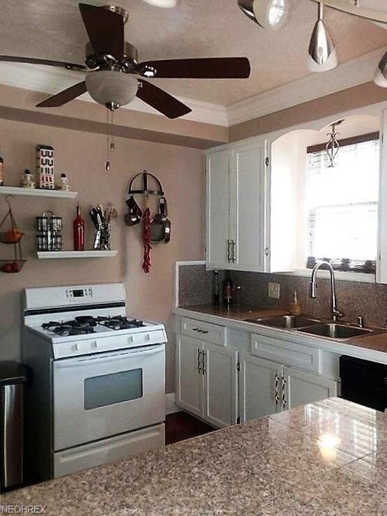 Updated kitchen with an island and a view into oth