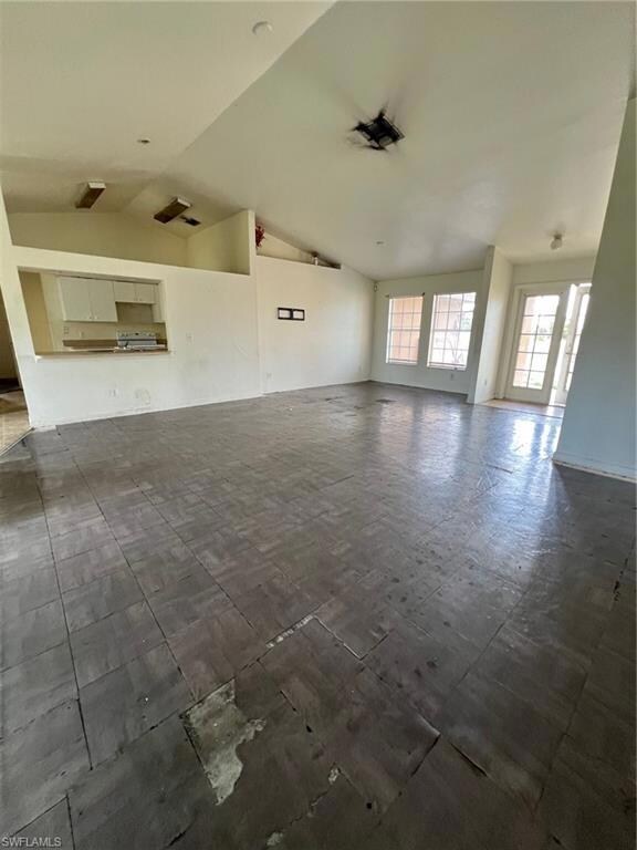 Living room featuring vaulted ceiling