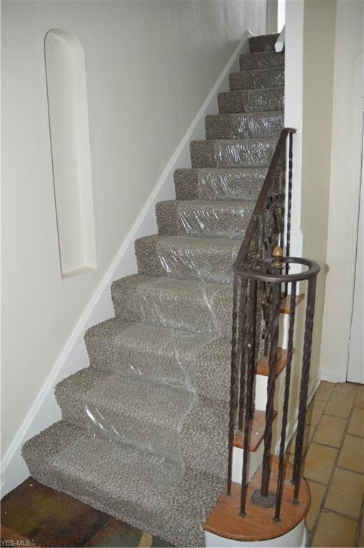 Foyer Entry with stairs to the second floor.  Viny