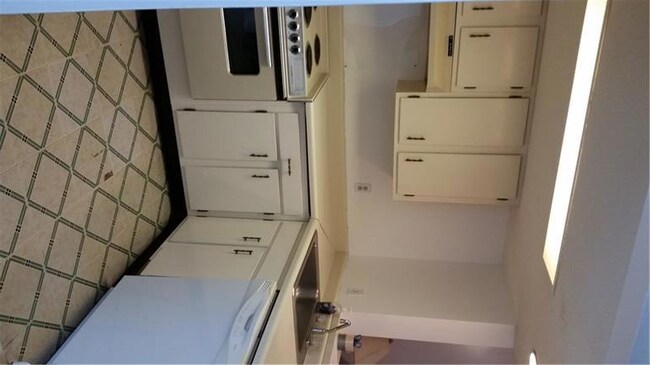 Kitchen includes range, dishwasher and fridge