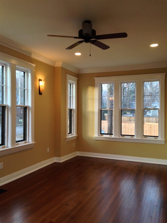 Living Room that flows into foyer.  All windows throughout the house have been refurbished and new storm windows installed.