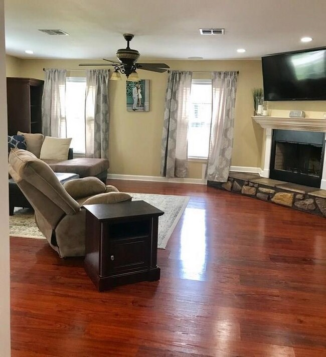 family room with wood burning fireplace