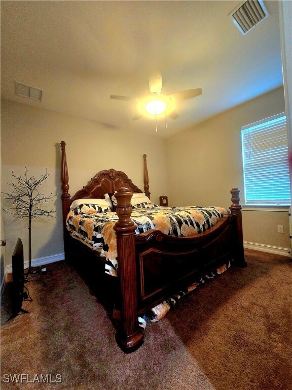 Bedroom with carpet floors, ceiling fan