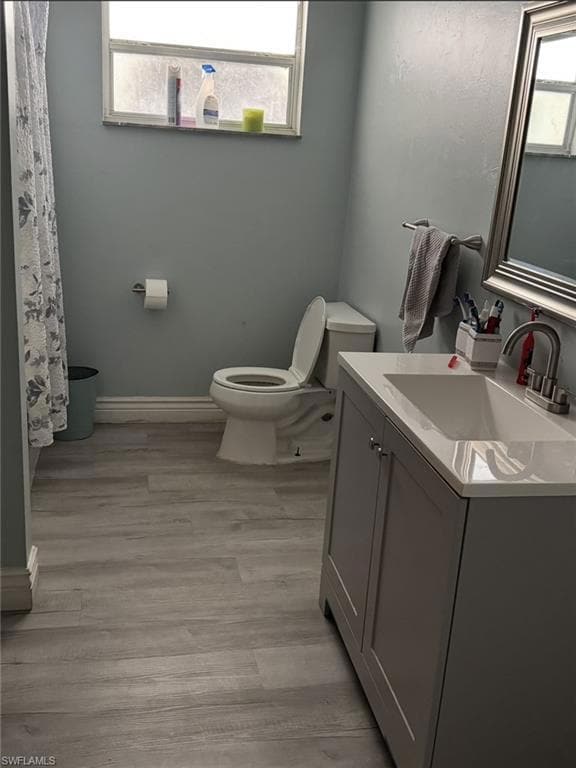Bathroom featuring vanity and wood finished floors