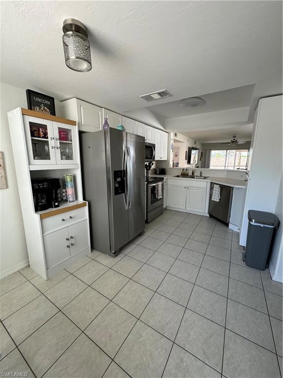 Kitchen featuring dishwashing machine, stove, visi