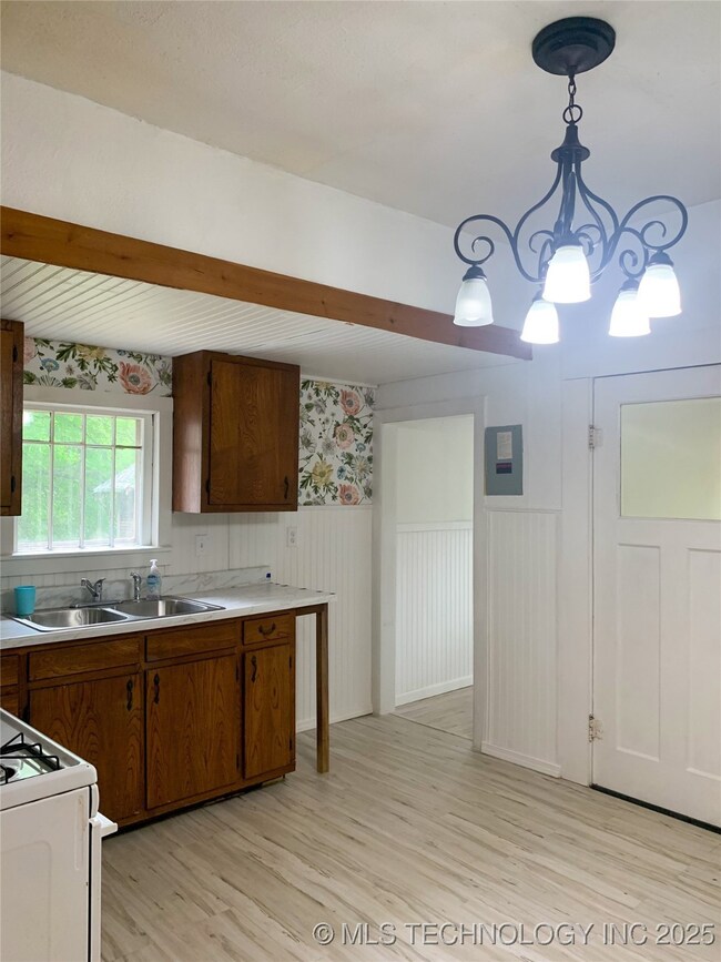 Kitchen featuring light wood finished floors, ligh
