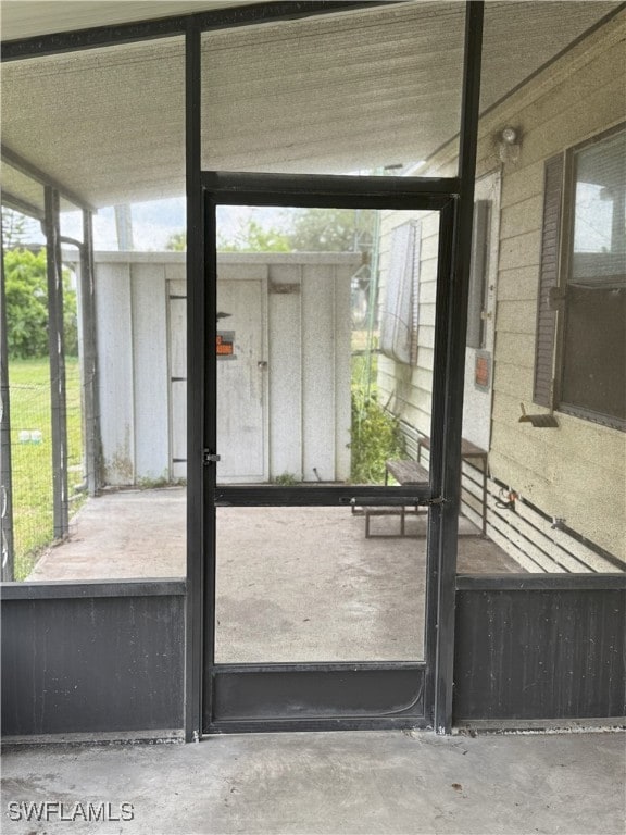 Doorway featuring a wealth of natural light and co