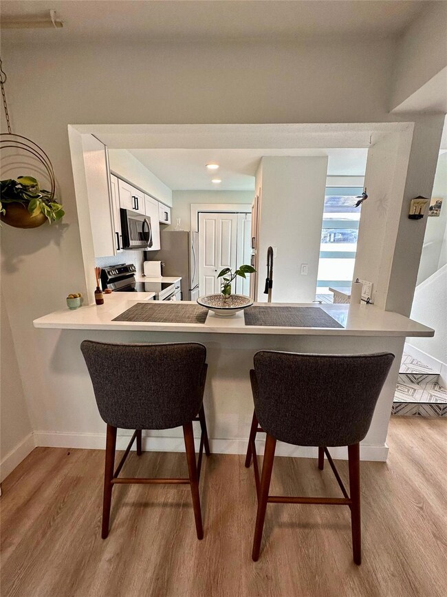 Dining area featuring baseboards and light wood-s