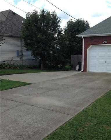 Additional parking pad goes all the way down the side of house to accommodate 2-3 additional cars.