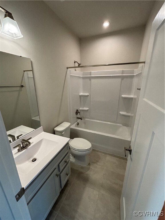 Bathroom featuring vanity, washtub / shower combination, and recessed lighting