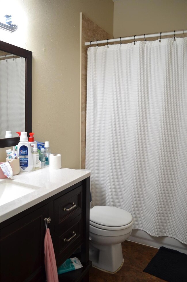 Full bathroom with vanity and toilet