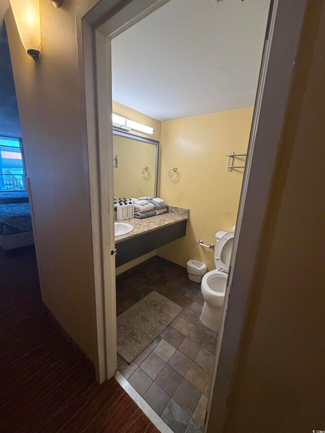 Half bath featuring toilet