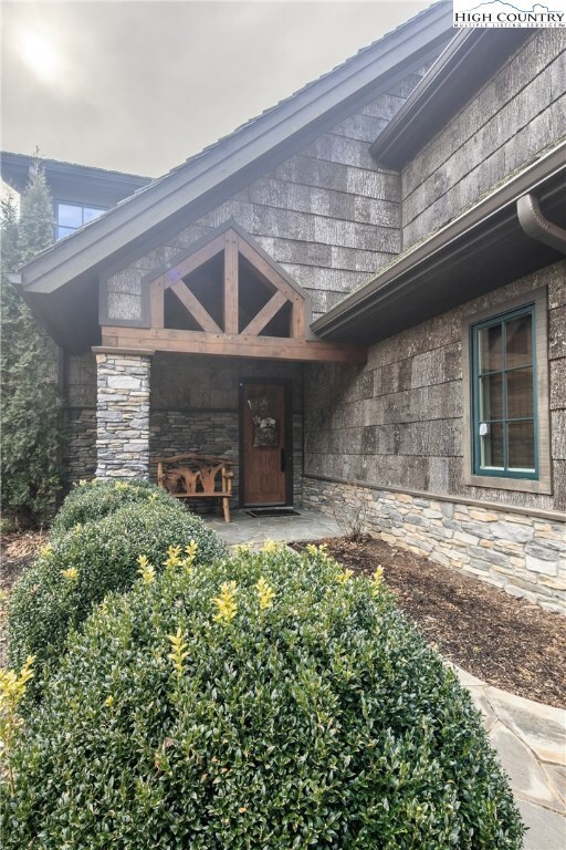 Covered entry with timber frame accent