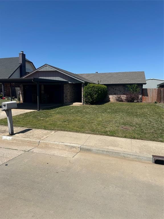 Ranch-style house with a garage, concrete driveway