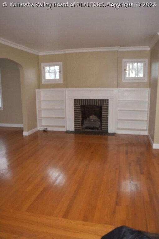 Large living room with gas fireplace and custom sh