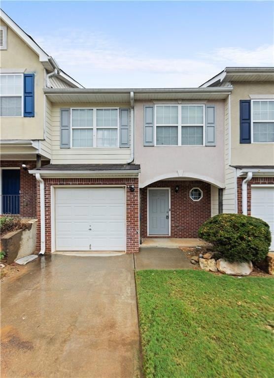 Townhome / multi-family property with brick siding