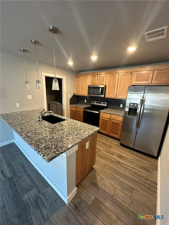 Granite counter tops offer a sleek look in the kit