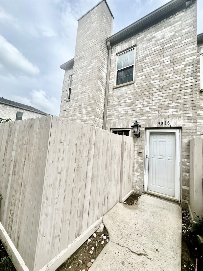 This is a two-story home with a brick facade, feat