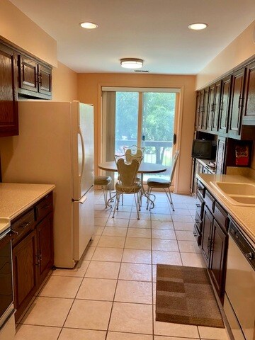 Eat in kitchen with plenty of cabinets, updated so