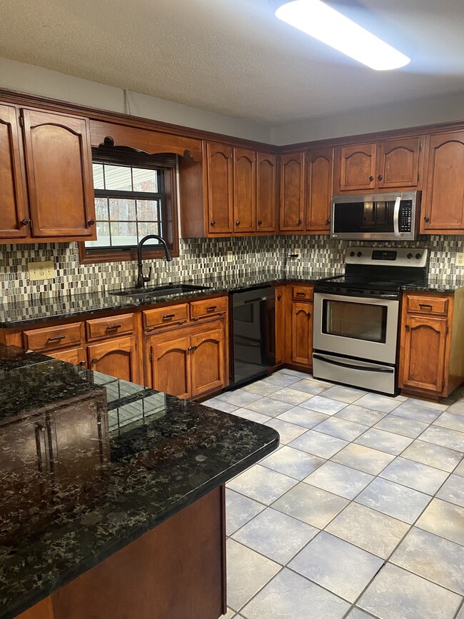 The kitchen is so nice! Very large with lots of cabinets and counter space. Granite counter tops, smooth surface stove, dishwasher and microwave