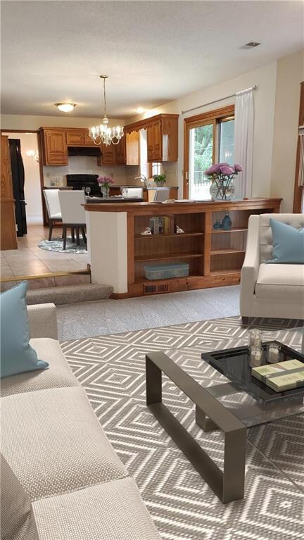 Great room looking over to the kitchen. Virtually 