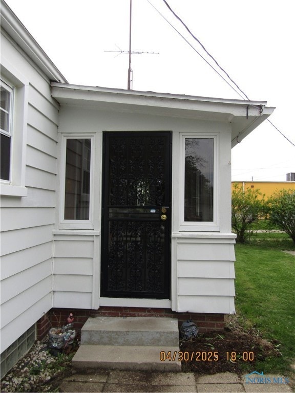 sunroom also provides entrance to back yard