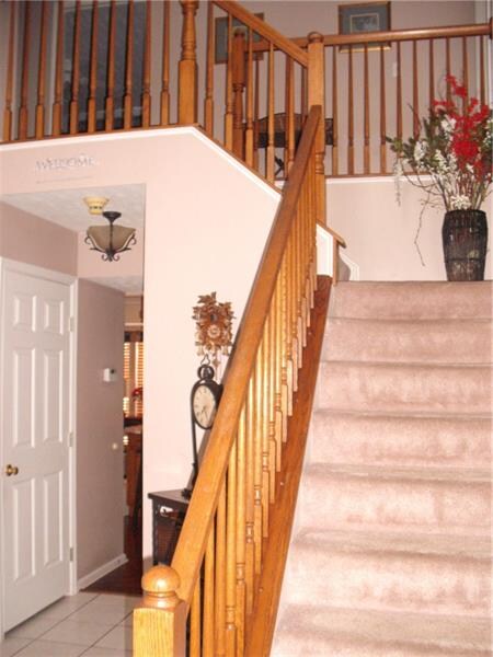 Foyer entrance with open staircase