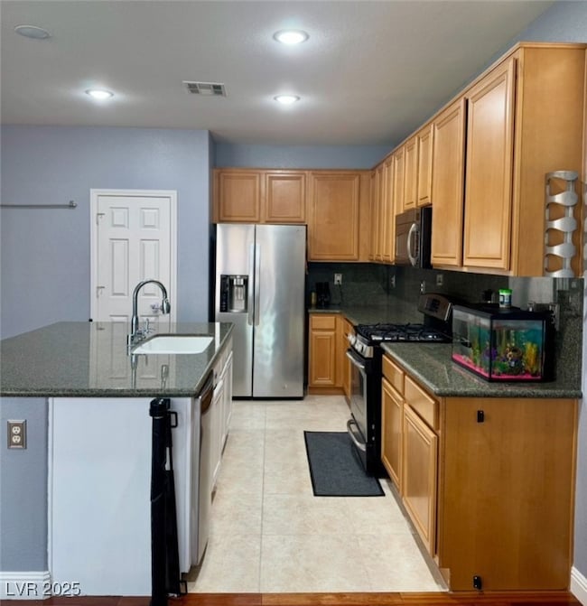 Kitchen featuring appliances with stainless steel