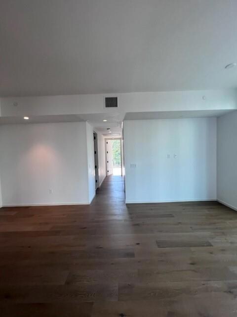 Unfurnished room with visible vents, recessed lig