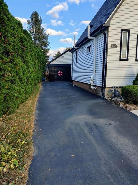 Driveway leading to detached garage