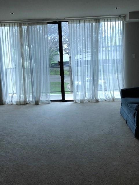 Unfurnished living room with carpet flooring and 