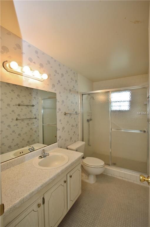 Guest bath lies adjacent to guest room.