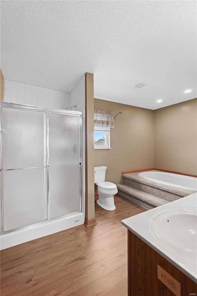 Master bathroom has separate soaking tub and showe