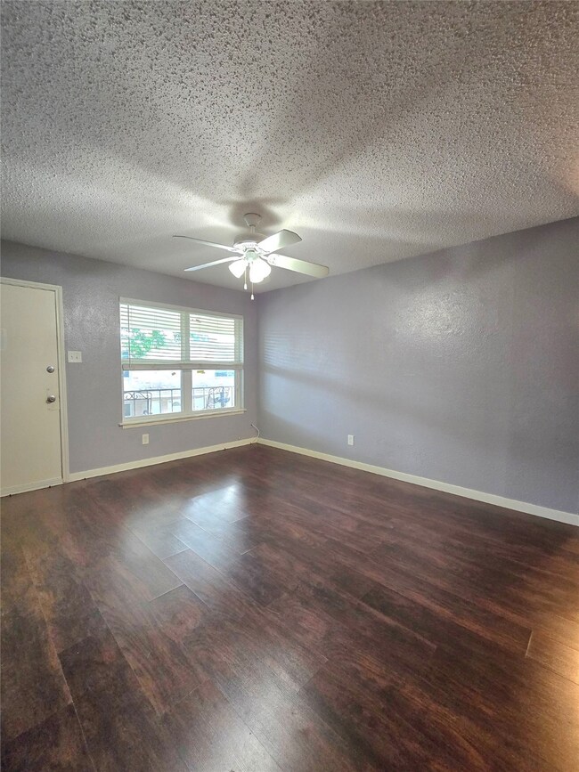 This inviting room boasts rich dark wood flooring,