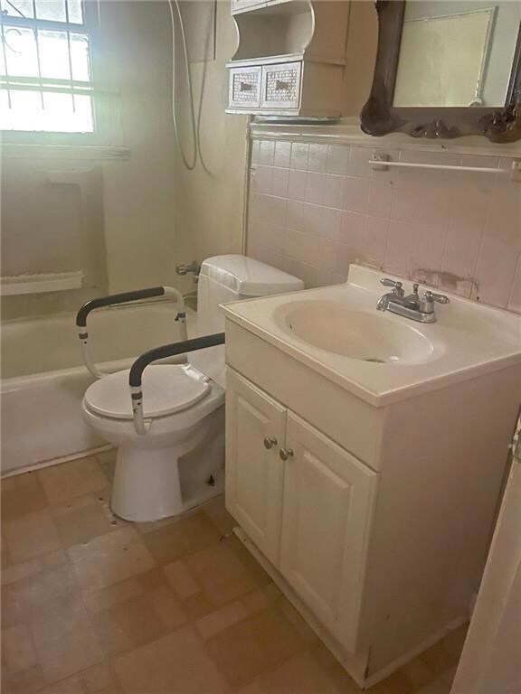 Bathroom featuring tile patterned flooring, tastef