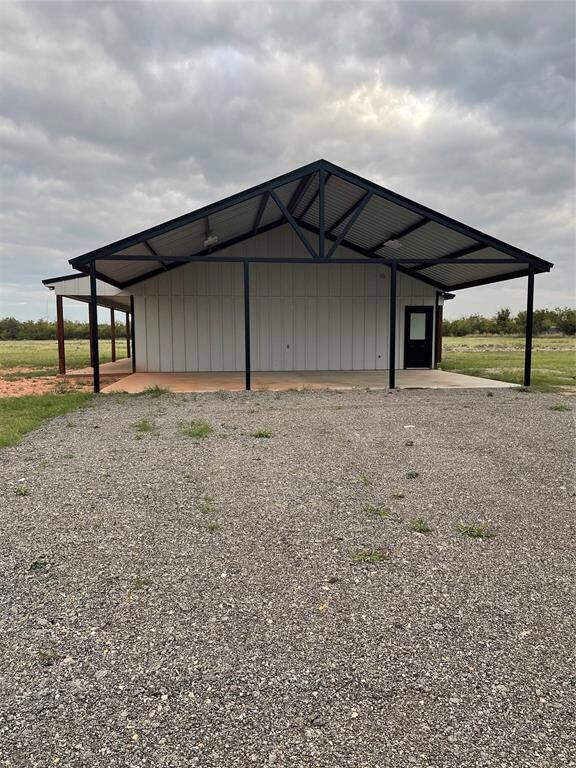 carport on south end of home