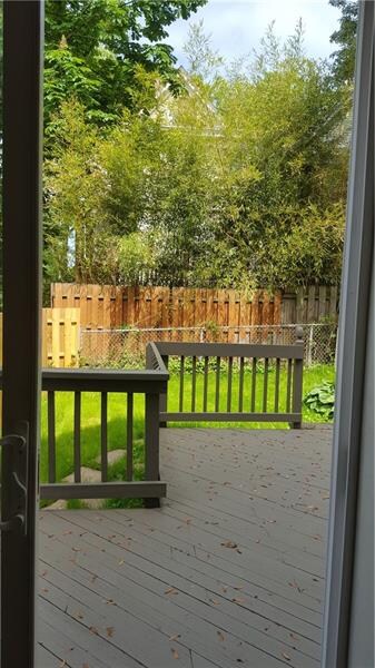Fenced level yard with great deck to entertain