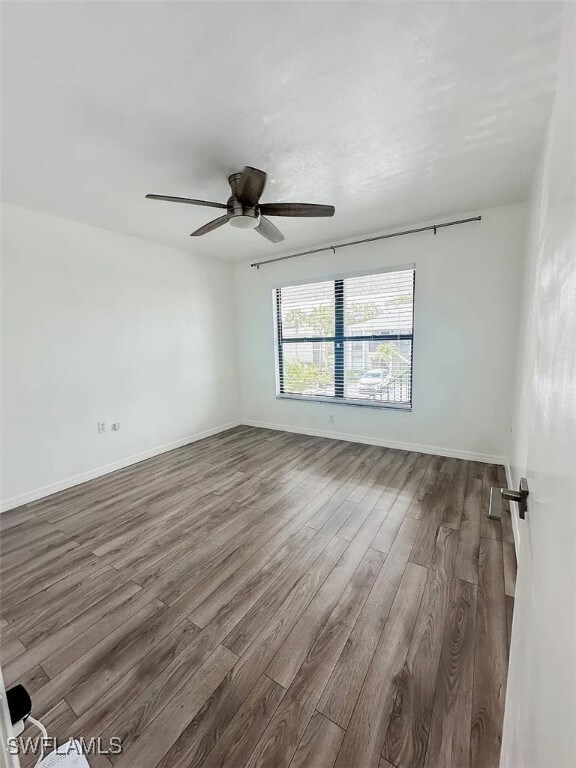 Unfurnished room with wood finished floors, ceilin