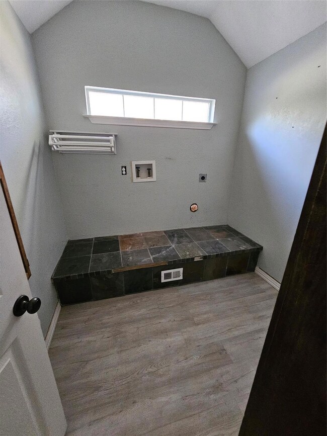 Laundry area featuring electric dryer hookup, gas 