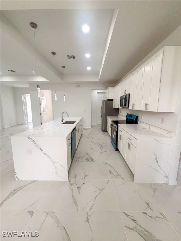 Kitchen with appliances with stainless steel finis