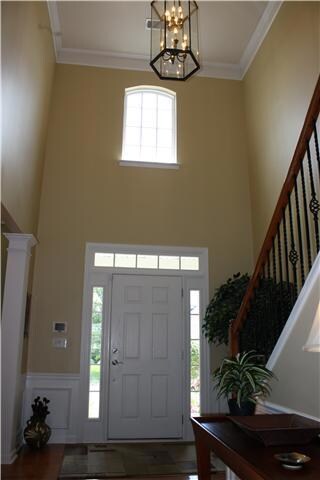 2-level, open Grand Foyer entrance with Iron Spindles