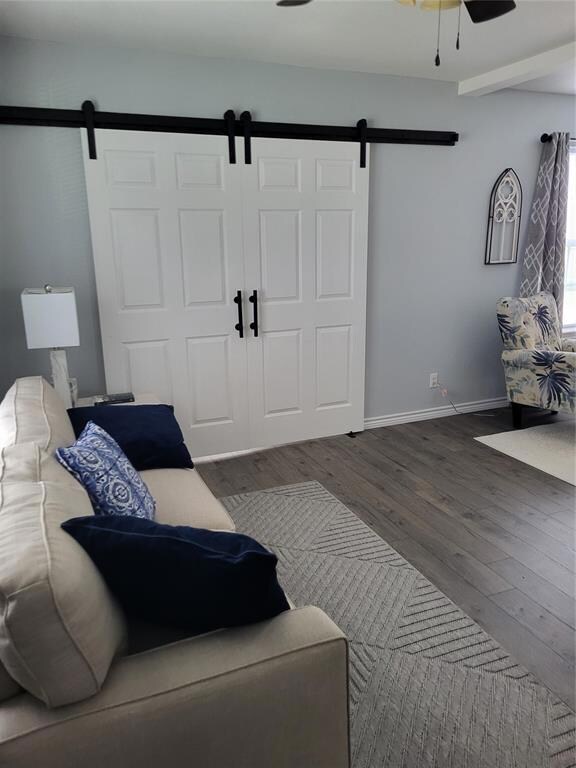 Living room with dark hardwood / wood-style floors