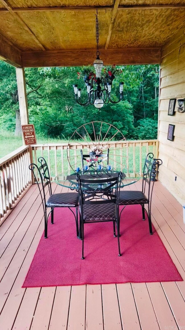 Front porch dining space with solar chandelier